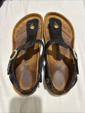 Birkenstock Black Leather Thong Sandals with Gold Accents